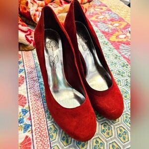 Red suede pumps